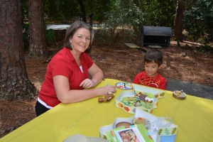 Logan and Jeannie playing games at the picnic table